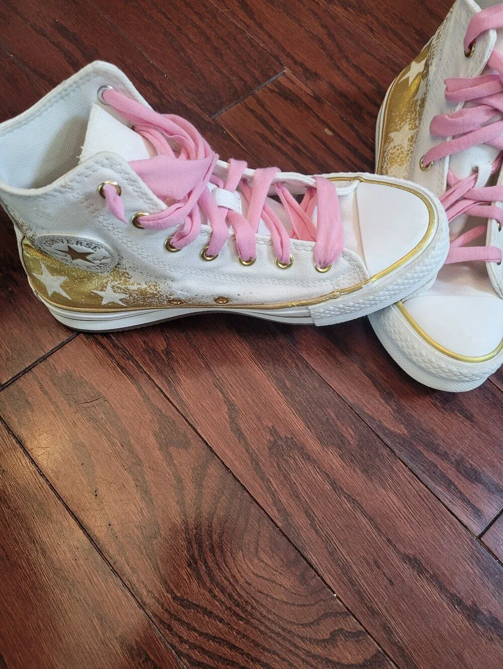 White High-Top Converse Chuck Taylor Sneakers with Pink Laces